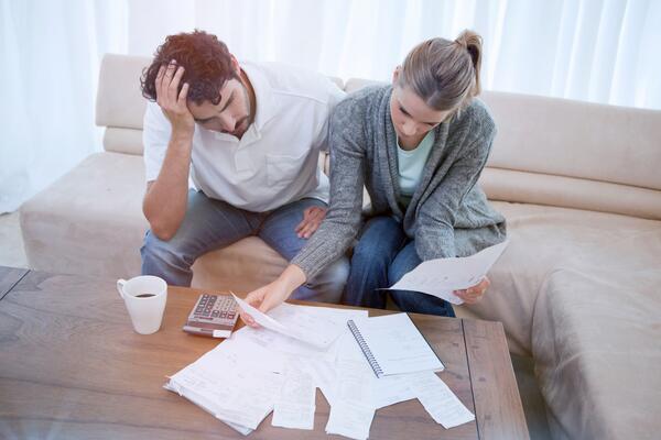 Depressed couple doing their accounting