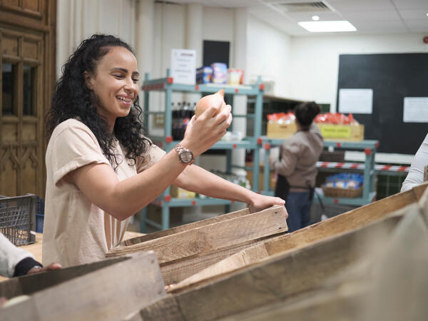 Volunteer working in community food center