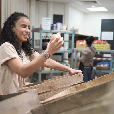 Volunteer working in community food center