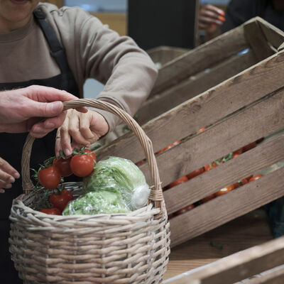 Volunteers sorting vegetables in community food center