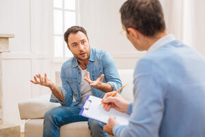 Amazed shocked man complaining about his wife