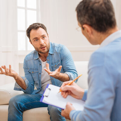 Amazed shocked man complaining about his wife 